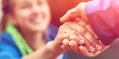 guy holding girls hand