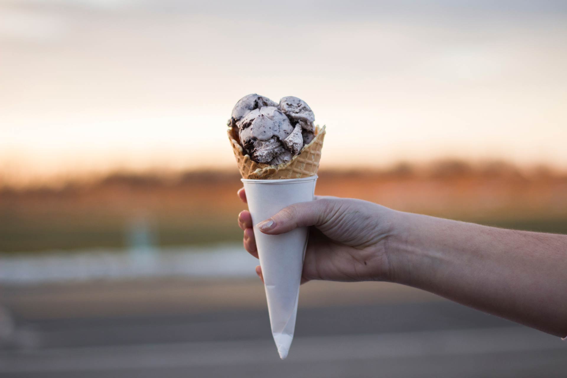 icecream cone in someones hand